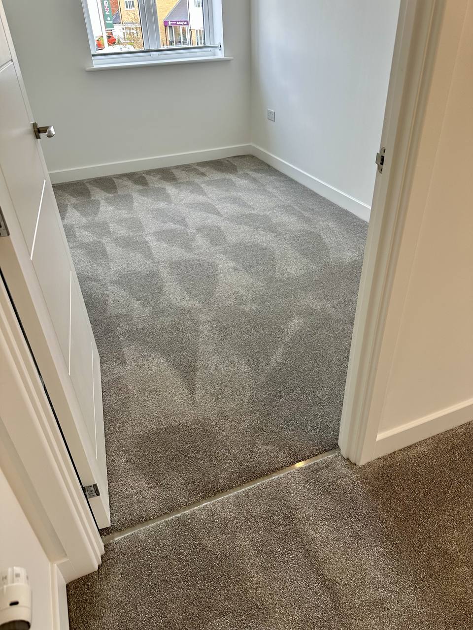Grey carpet in a bedroom